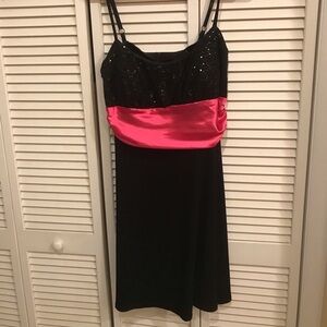 Dress Barn Collection black party dress with pink sash, size 10.